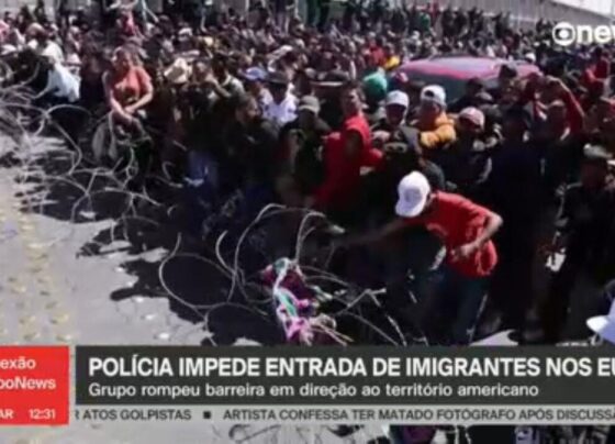 video:-centenas-de-migrantes-no-mexico-tentam-entrar-a-forca-nos-eua